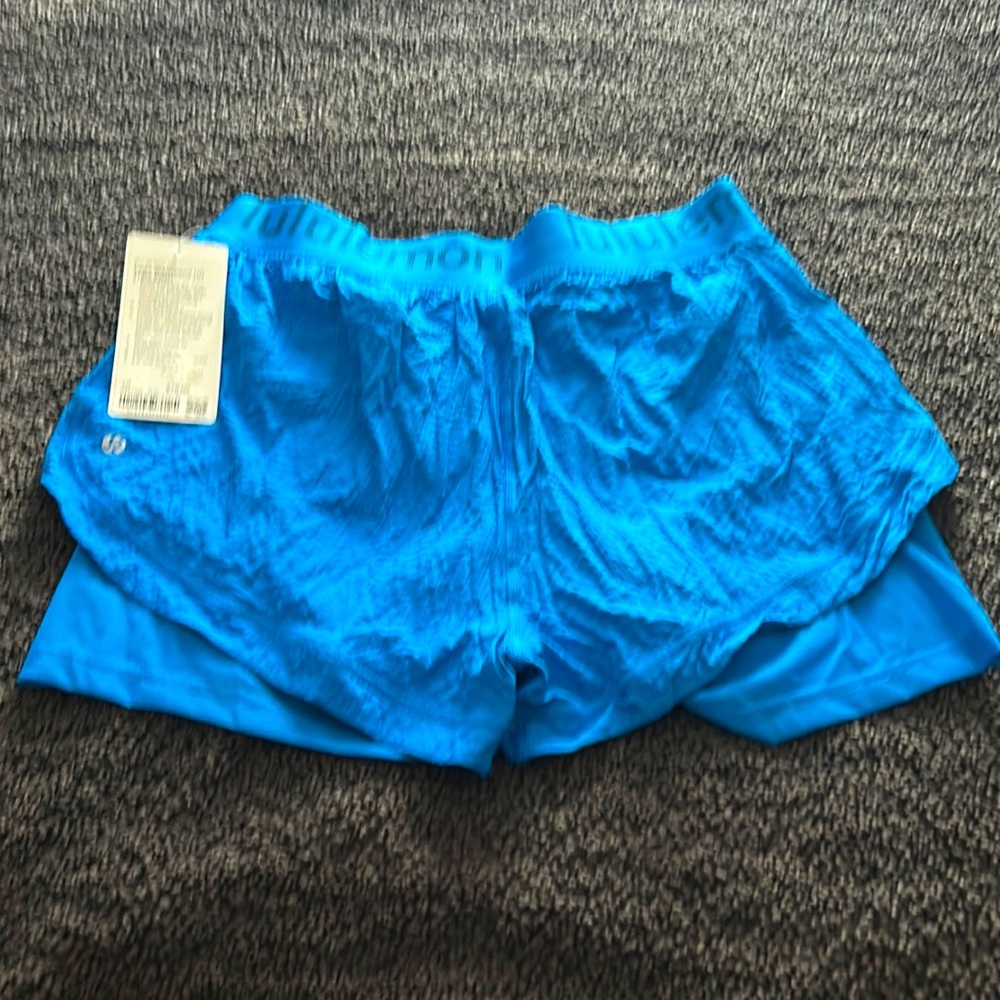 Brand new Lululemon Waistband Train Short. Turquoise blue. Biker short inside.